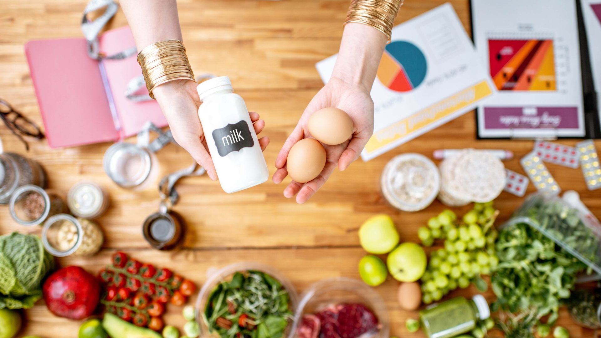 dietitian-holding-eggs-and-milk-above-the-table-fu-2025-03-14-22-49-29-utc-min